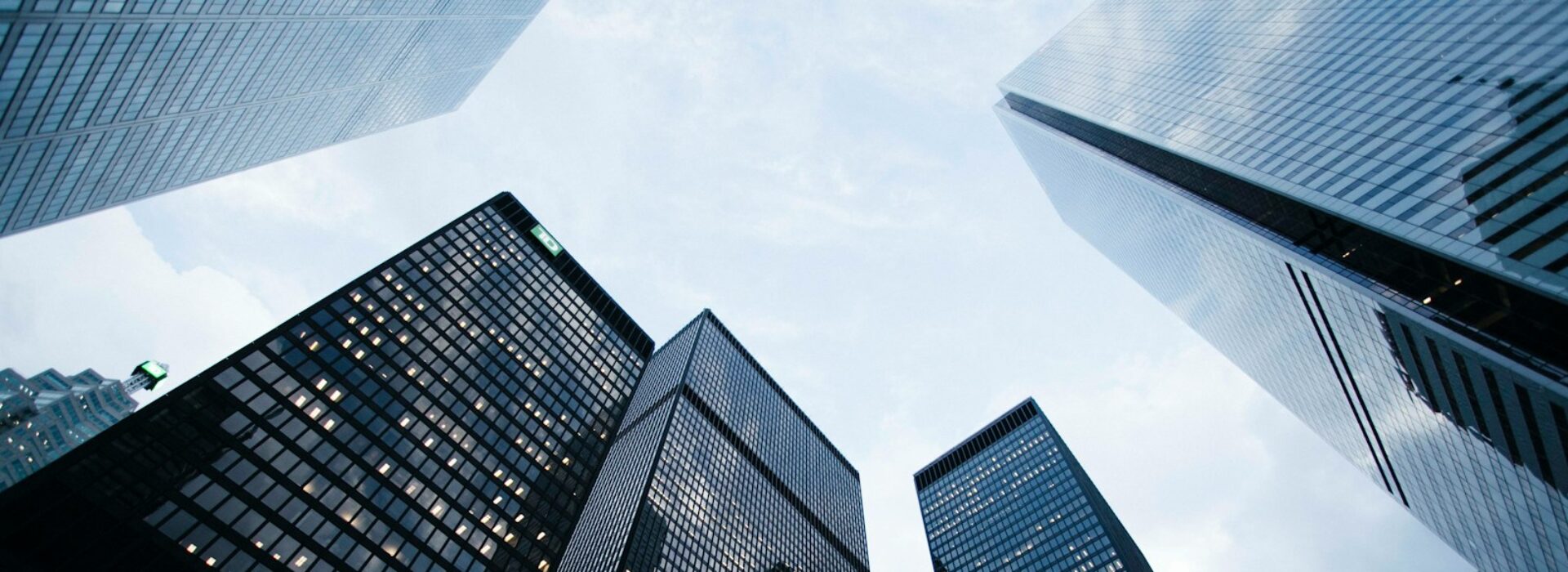 low angle photo of city high rise buildings during daytime