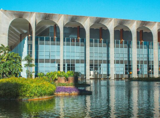 A large building sitting next to a body of water